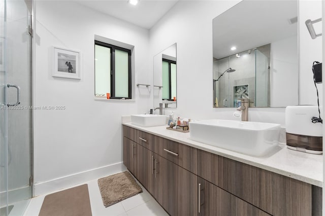 2485 SW 19th Ter, Miami, FL 33145 - bathroom featuring a shower stall, double vanity, tile patterned floors, and recessed lighting