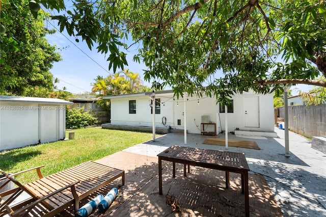 2485 SW 19th Ter, Miami, FL 33145 - back of house with a patio area, a fenced backyard, and stucco siding
