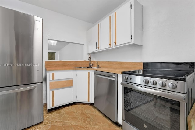 7450 NW 17th St Unit 207, Plantation, FL 33313 - kitchen featuring appliances with stainless steel finishes and white cabinets