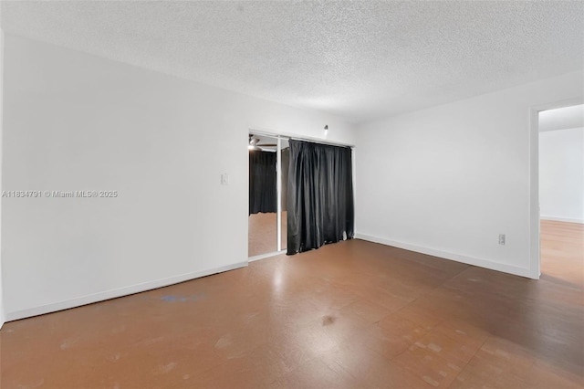 7450 NW 17th St Unit 207, Plantation, FL 33313 - spare room featuring a textured ceiling and baseboards