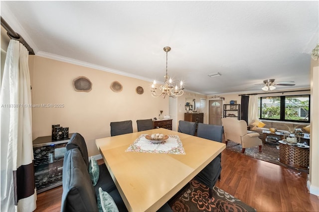 11193 SW 113th Ter, Miami, FL 33176 - dining space featuring dark wood-type flooring, crown molding, a chandelier, and a ceiling fan