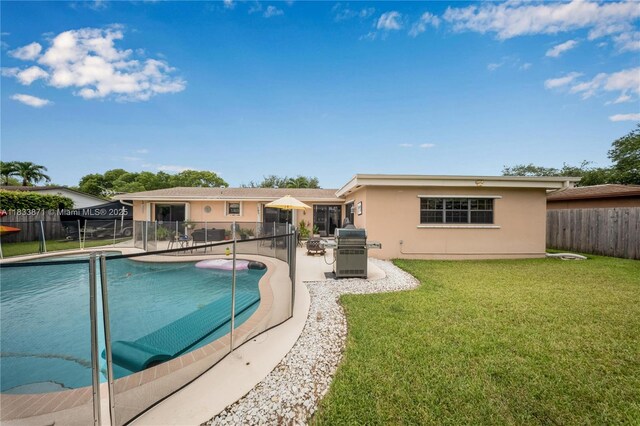 11193 SW 113th Ter, Miami, FL 33176 - view of swimming pool featuring a fenced backyard, a patio area, and a grill