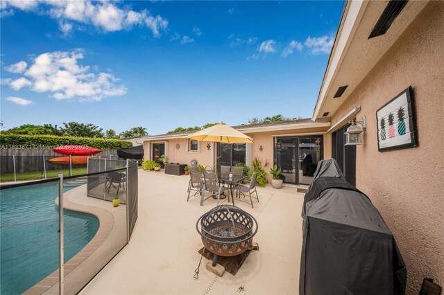 11193 SW 113th Ter, Miami, FL 33176 - view of swimming pool with a patio, an outdoor fire pit, and outdoor dining space