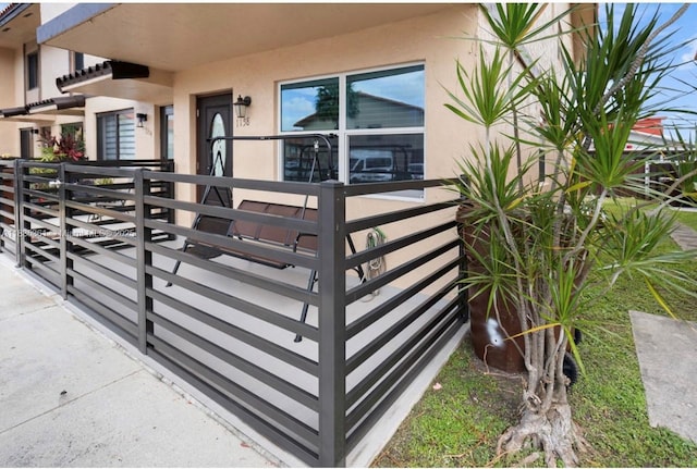 1158 W 41st St Unit 87, Hialeah, FL 33012 - view of exterior entry featuring stucco siding