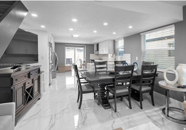 1158 W 41st St Unit 87, Hialeah, FL 33012 - dining area with recessed lighting, healthy amount of natural light, and light marble finish flooring