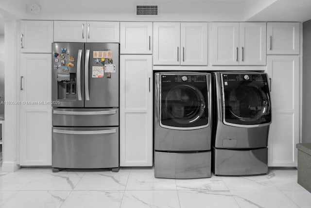 1158 W 41st St Unit 87, Hialeah, FL 33012 - laundry room featuring washer and clothes dryer and light marble finish floors
