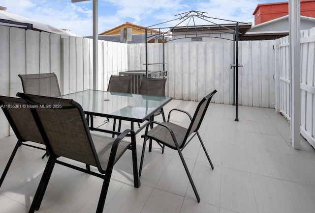 1158 W 41st St Unit 87, Hialeah, FL 33012 - fenced backyard with outdoor dining area and a patio