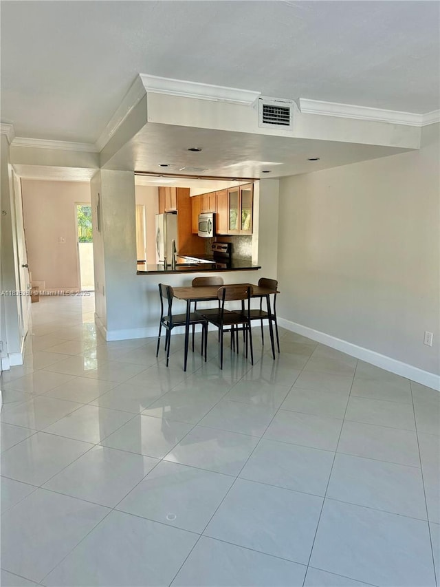 8240 SW 149th Ct Unit 7-202, Miami, FL 33193 - dining room with crown molding and light tile patterned floors