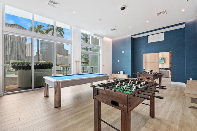 90 SW 3rd St Unit 3810, Miami, FL 33130 - rec room featuring light wood finished floors, expansive windows, pool table, a towering ceiling, and recessed lighting