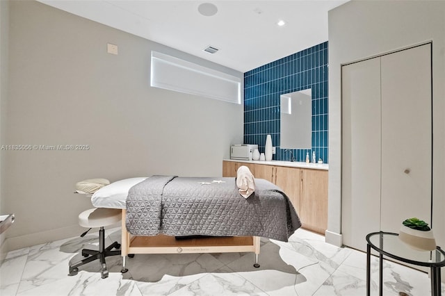 90 SW 3rd St Unit 3810, Miami, FL 33130 - bedroom with marble look tiles and tile walls