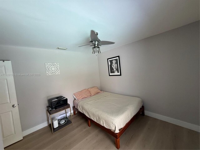14135 SW 100th Ln, Miami, FL 33186 - bedroom featuring light wood finished floors and a ceiling fan