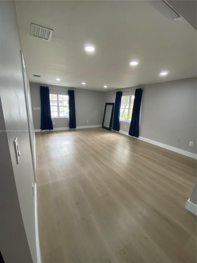 14135 SW 100th Ln, Miami, FL 33186 - empty room with healthy amount of natural light, light wood finished floors, and recessed lighting