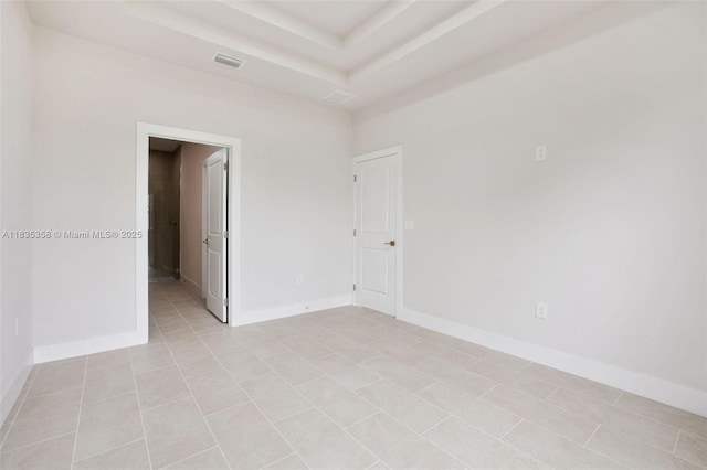 4873/4875 29th St SW, Lehigh Acres, FL 33973 - empty room with a raised ceiling and baseboards