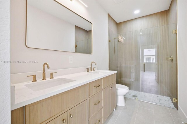 4873/4875 29th St SW, Lehigh Acres, FL 33973 - bathroom with tiled shower, double vanity, and tile patterned flooring