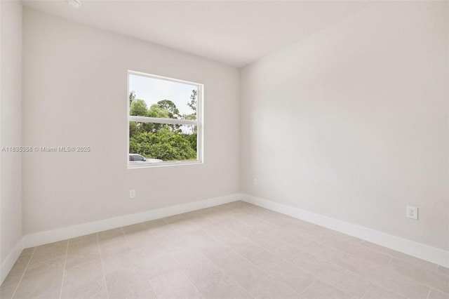 4873/4875 29th St SW, Lehigh Acres, FL 33973 - spare room with light tile patterned flooring
