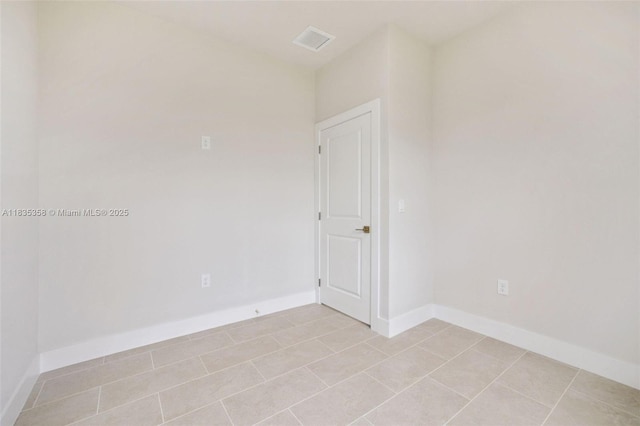 4873/4875 29th St SW, Lehigh Acres, FL 33973 - unfurnished room with light tile patterned floors and baseboards
