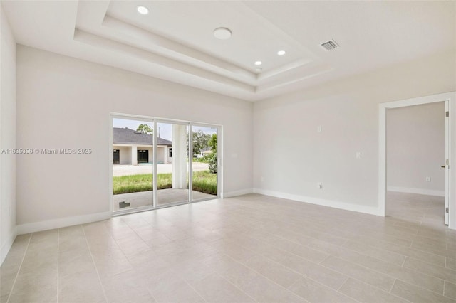 4873/4875 29th St SW, Lehigh Acres, FL 33973 - spare room with a raised ceiling, recessed lighting, and light tile patterned floors