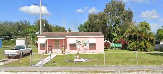 1881 NW 157th St, Miami Gardens, FL 33054 - view of front of property featuring a gate and stucco siding
