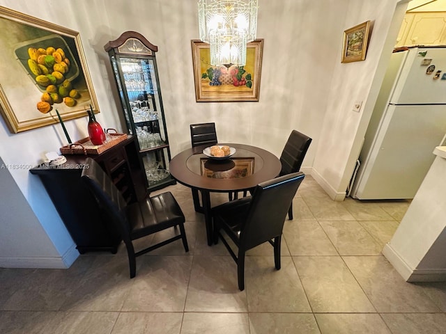 5300 Washington St Unit N318, Hollywood, FL 33021 - dining area featuring a chandelier and light tile patterned flooring