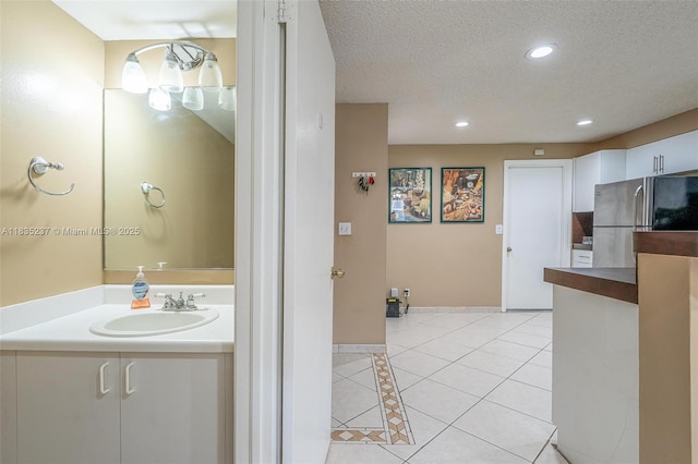 1528 Veracruz Ln Unit 4-3, Weston, FL 33327 - bathroom with tile patterned flooring, vanity, recessed lighting, and a textured ceiling