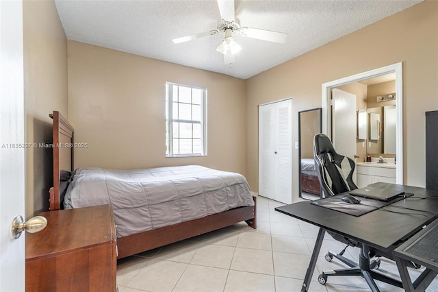 1528 Veracruz Ln Unit 4-3, Weston, FL 33327 - bedroom with a desk, light tile patterned floors, a closet, ceiling fan, and a textured ceiling