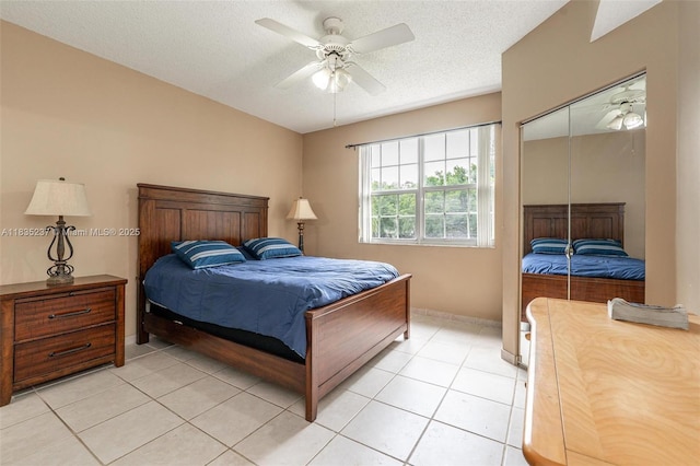 1528 Veracruz Ln Unit 4-3, Weston, FL 33327 - bedroom featuring a textured ceiling, light tile patterned flooring, a ceiling fan, and a closet