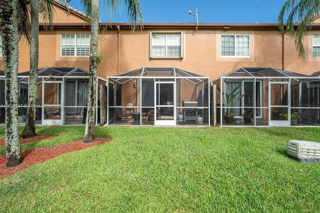 1528 Veracruz Ln Unit 4-3, Weston, FL 33327 - back of house featuring a yard and stucco siding