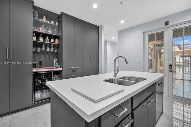 14646 SW 13th St, Pembroke Pines, FL 33027 - kitchen featuring wine cooler, light marble finish floors, a center island with sink, recessed lighting, and gray cabinetry