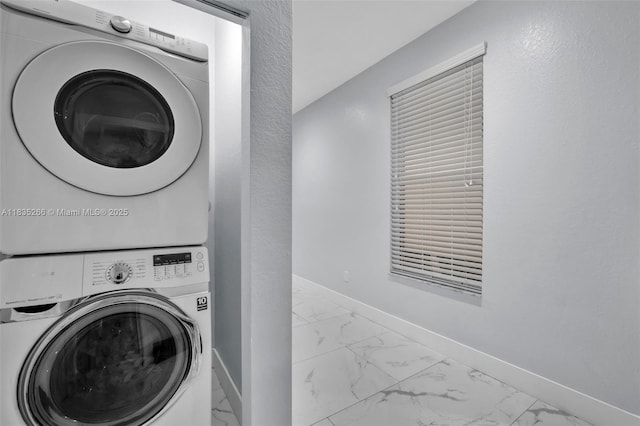 14646 SW 13th St, Pembroke Pines, FL 33027 - laundry room featuring stacked washing machine and dryer and light marble finish floors