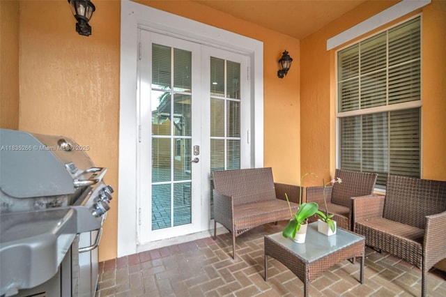 14646 SW 13th St, Pembroke Pines, FL 33027 - view of exterior entry with stucco siding and french doors
