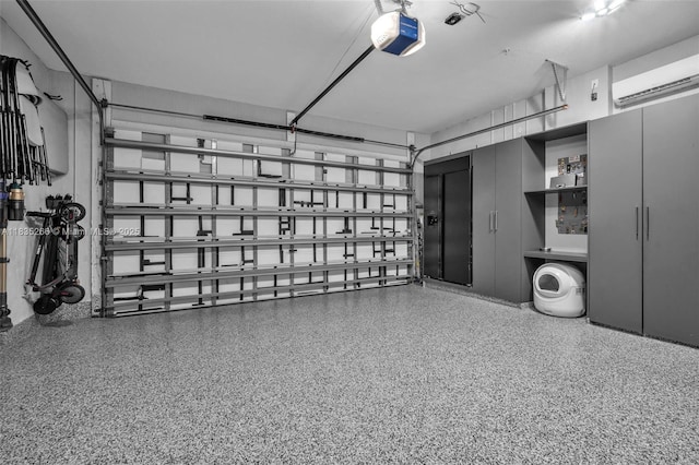 14646 SW 13th St, Pembroke Pines, FL 33027 - garage with a garage door opener and an AC wall unit