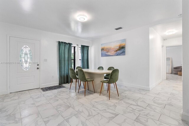 1100 NW 151st St, Miami, FL 33169 - dining space with light marble finish flooring and healthy amount of natural light