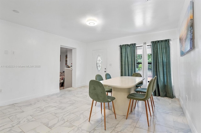 1100 NW 151st St, Miami, FL 33169 - dining room with light marble finish flooring and baseboards