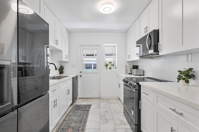 1100 NW 151st St, Miami, FL 33169 - kitchen with refrigerator, black electric range, light marble finish flooring, stainless steel dishwasher, and white cabinetry
