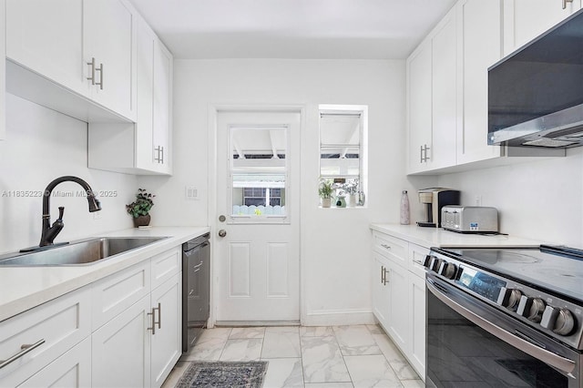 1100 NW 151st St, Miami, FL 33169 - kitchen with stainless steel appliances, light marble finish floors, light countertops, and white cabinets