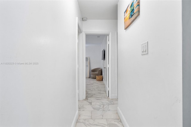 1100 NW 151st St, Miami, FL 33169 - corridor featuring light marble finish flooring and baseboards