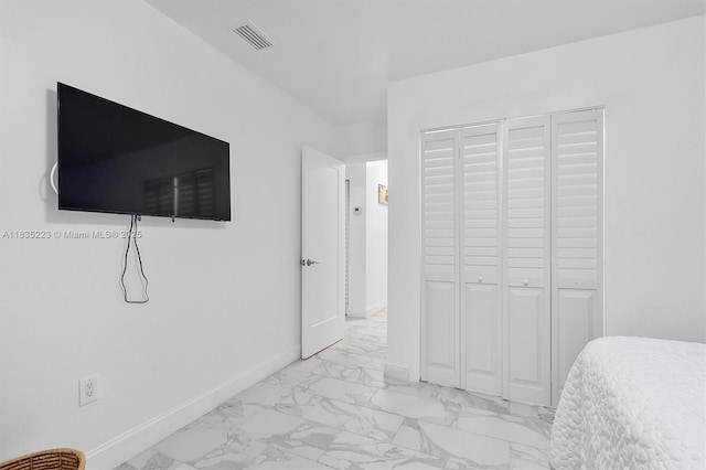 1100 NW 151st St, Miami, FL 33169 - bedroom featuring light marble finish flooring and a closet