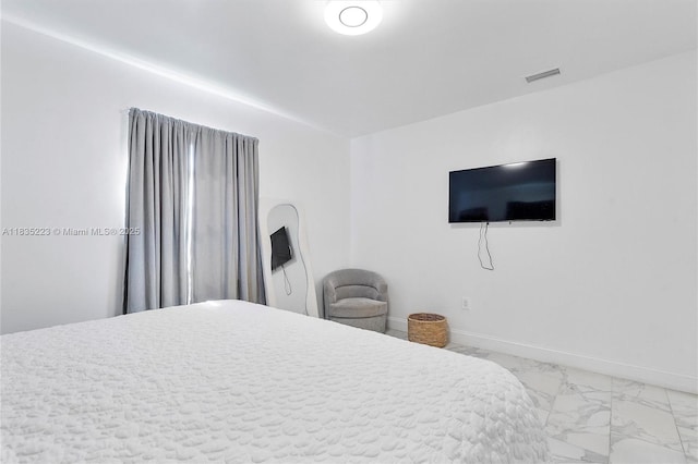 1100 NW 151st St, Miami, FL 33169 - bedroom with marble look tiles and baseboards