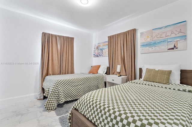 1100 NW 151st St, Miami, FL 33169 - bedroom with marble look tile flooring and baseboards