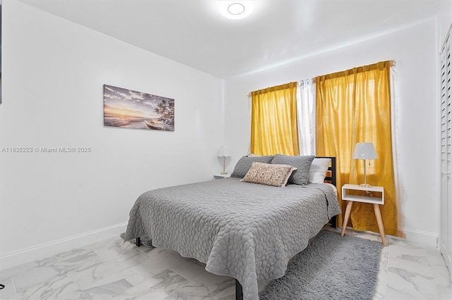 1100 NW 151st St, Miami, FL 33169 - bedroom with marble look tiles and baseboards