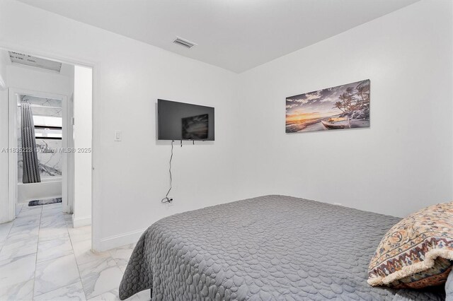1100 NW 151st St, Miami, FL 33169 - bedroom featuring light marble finish floors and baseboards