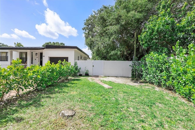 1100 NW 151st St, Miami, FL 33169 - view of yard with a garage and a gate