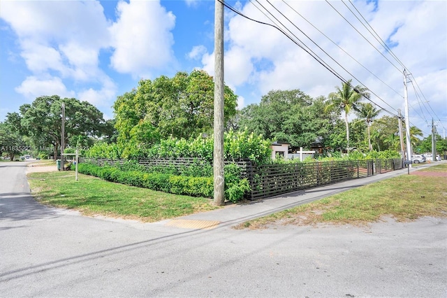 1100 NW 151st St, Miami, FL 33169 - view of asphalt road featuring street lights and view of scattered trees