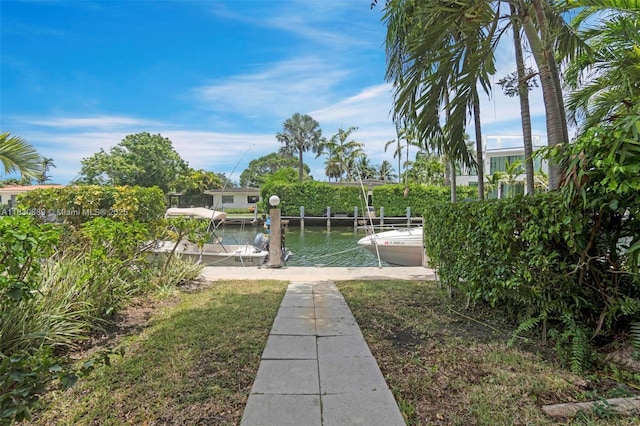 1426 NE 105th St Unit D9, Miami Shores, FL 33138 - view of yard with a boat dock and a water view