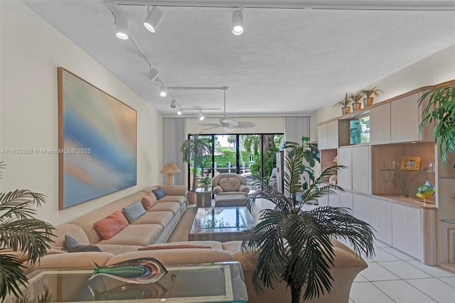 1426 NE 105th St Unit D9, Miami Shores, FL 33138 - living room featuring rail lighting and light tile patterned floors