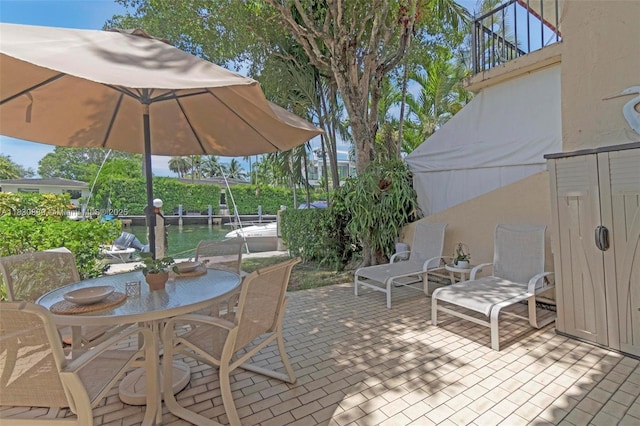 1426 NE 105th St Unit D9, Miami Shores, FL 33138 - patio / terrace featuring outdoor dining area, a patio area, and a boat dock