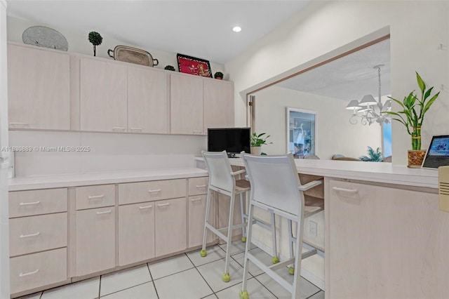 1426 NE 105th St Unit D9, Miami Shores, FL 33138 - kitchen with light countertops, light tile patterned floors, a chandelier, recessed lighting, and decorative light fixtures