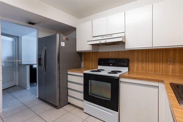 2500 Parkview Dr Unit 1502, Hallandale Beach, FL 33009 - kitchen featuring range with electric stovetop, under cabinet range hood, white cabinets, light tile patterned flooring, and stainless steel refrigerator with ice dispenser