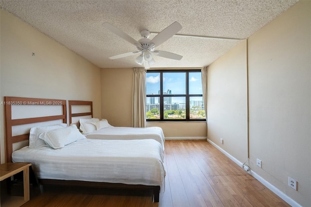 2500 Parkview Dr Unit 1502, Hallandale Beach, FL 33009 - bedroom with a textured ceiling, a ceiling fan, and wood finished floors