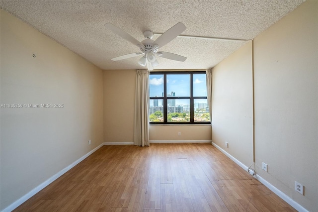 2500 Parkview Dr Unit 1502, Hallandale Beach, FL 33009 - unfurnished room featuring ceiling fan, wood finished floors, and a textured ceiling